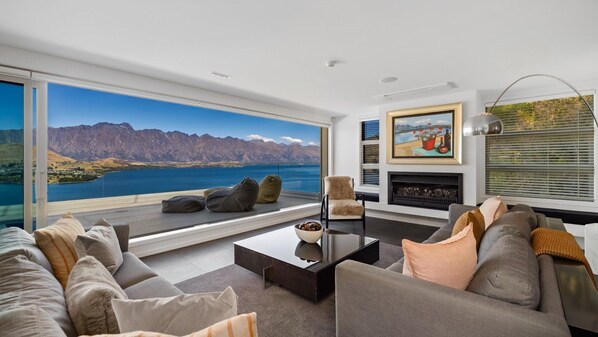 Living room with stunning panoramic views of The Remarkables range - NZ luxury travel