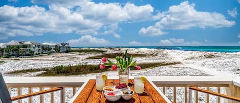 Kick Back & Relax on the Patio overlooking the Sand Dunes, Turquoise Waters & Boats cruising the Harbor