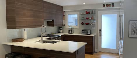 Just remodeled!  Brand new, modern kitchen with subzero fridge, dual fuel range+