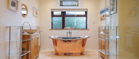 Luxurious family bathroom with stunning William Holland copper bateau bath