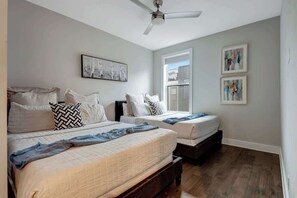 Third floor guest suite with two queen beds and full en suite bathroom