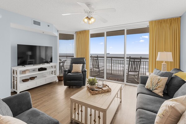 Spacious living room with couch, loveseat and leather recliner