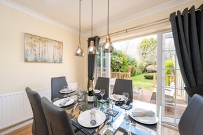 The dining room overlooks the garden and private decking area.