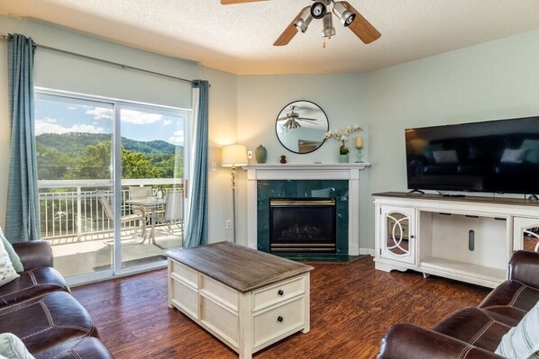 This room is perfectly designed for you to unwind and enjoy, with a fantastic view waiting for you and a seasonal fireplace for the colder months!