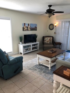 Roomy Living-room with TV and Private Patio Access.