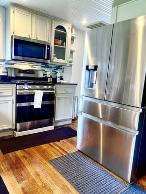 Kitchen: Samsung refrigerator,  Samsung range, KitchenAid microwave & dishwasher