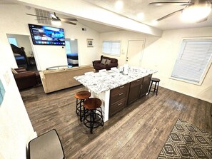 Big kitchen island and 70" smart TV
