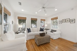 LIVING AREA FEATURING FLATSCREEN TV AND SEATING