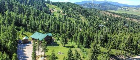 Enjoy the trees and Bridger Mountain views from this 3 bedroom home with a hot tub!