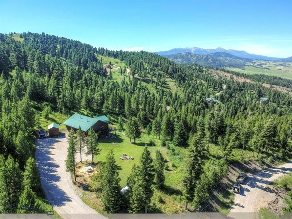 Enjoy the trees and Bridger Mountain views from this 3 bedroom home with a hot tub!