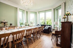 Beautiful dining-room, with seating for 12+, piano and open fire-place 