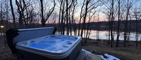 The luxurious warmth of our brand-new hot tub while delighting in the breathtaking view of the lake.