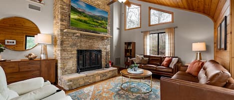 Living Room With 75" HDTV and Wood Fireplace