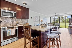 Complete well stocked kitchen with dining/ working area.