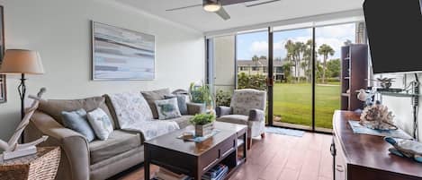 Confortable living room area with queen size sofa bed and smart TV.