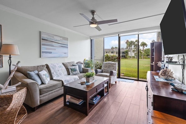 Confortable living room area with queen size sofa bed and smart TV.