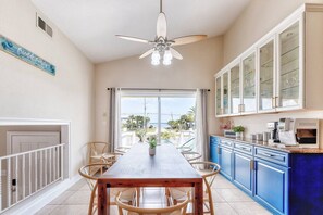 Huge dining room has a direct water view and sound of Pensacola. FYI: espresso machine no longer available. 