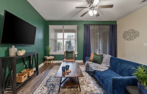 Large living room with 60 in smart TV