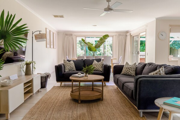 Open plan lounge with smart TV