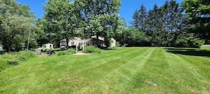 Large side yard perfect for sunning, yard games, BBQs, and more