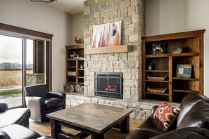 Cozy up around the gas fireplace in the living room.