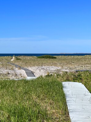 A meandering boardwalk leads to our private beach from Sea Glass Cottage..