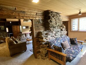 Huge stone fireplace, real log walls, futon for extra guests