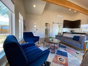 Cozy doesn't have to mean crowded! Timber + Tin B offers ample space to unwind, plus a comfy sofa bed and air mattress to accommodate up to four guests.