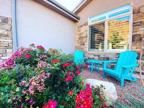 Even the front yard offers a little oasis and private seating area.
