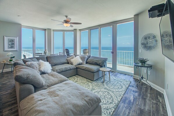 Living room offering large sectional/modular sofa.