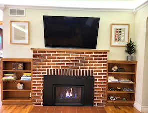 Warm up next to an easy-on fireplace, 55" HDTV, and room to spread out.