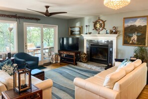 Gather around the big screen TV in the family room overlooking the deck.