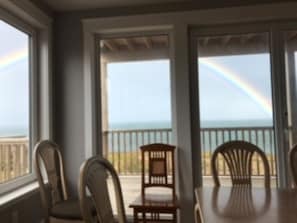 Dinning room facing the Gulf. Look at the rainbow over the ocean!