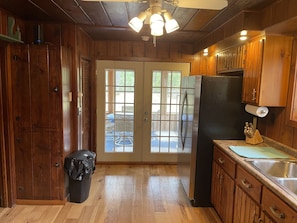 Kitchen with doors out to 3 season room