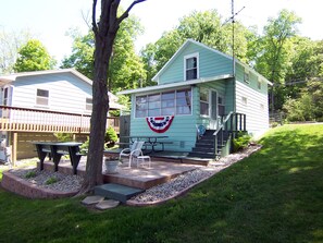 View from lake. Nice big front yard with fire pit. CottagesOfLakeJames.com