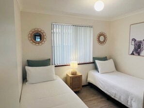 2x Single beds with Built in robes