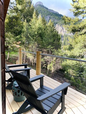 Wrap around deck with rocking chairs.  Perfect view of the river front. 