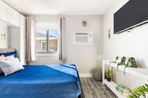 Bedroom with overhead cabinet space for storage 