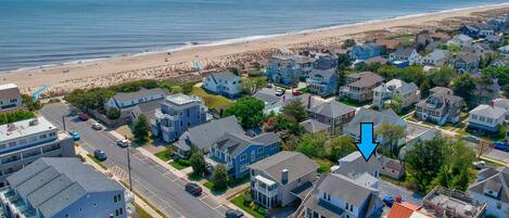 Sixth house from the beach.