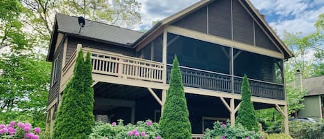Large porches overlooking the beautiful landscape on 14 Trillium Links Cashiers
