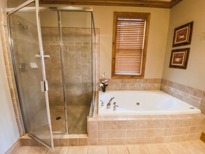 MasterBath with Walk In Shower and Jetted Tub.