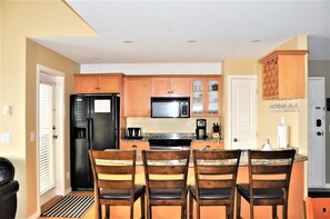 Gourmet kitchen with stone counters, ice maker and all the essentials