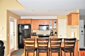 Gourmet kitchen with stone counters, ice maker and all the essentials