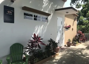 Secured area in front of home for 2 vehicles. Electrically controlled gate 