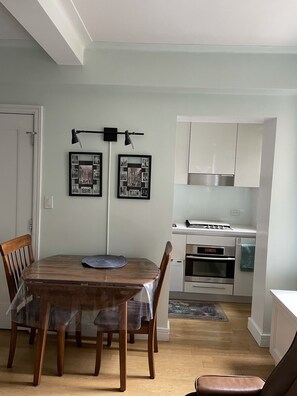 Dining Tables opens to seat 4]
