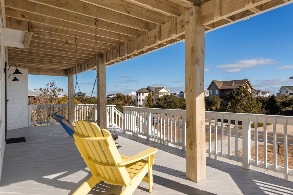 a porch with beach chairs