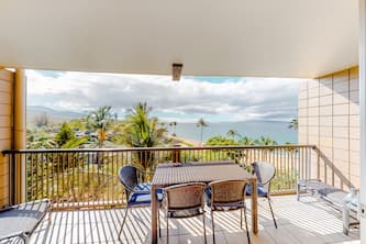 Resort condo steps from the beach with pool, gym & lanai