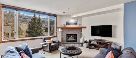 Comfortable living room with expansive views of the mountain.