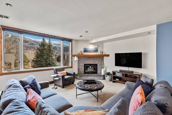 Comfortable living room with expansive views of the mountain.