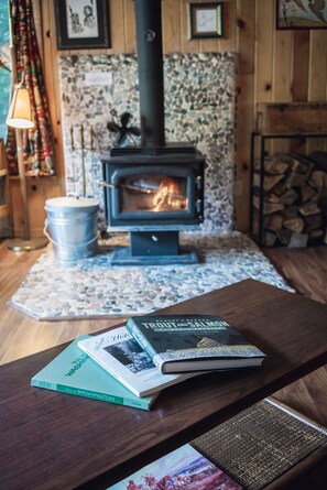 Enjoy the wood stove fireplace while reading a new book